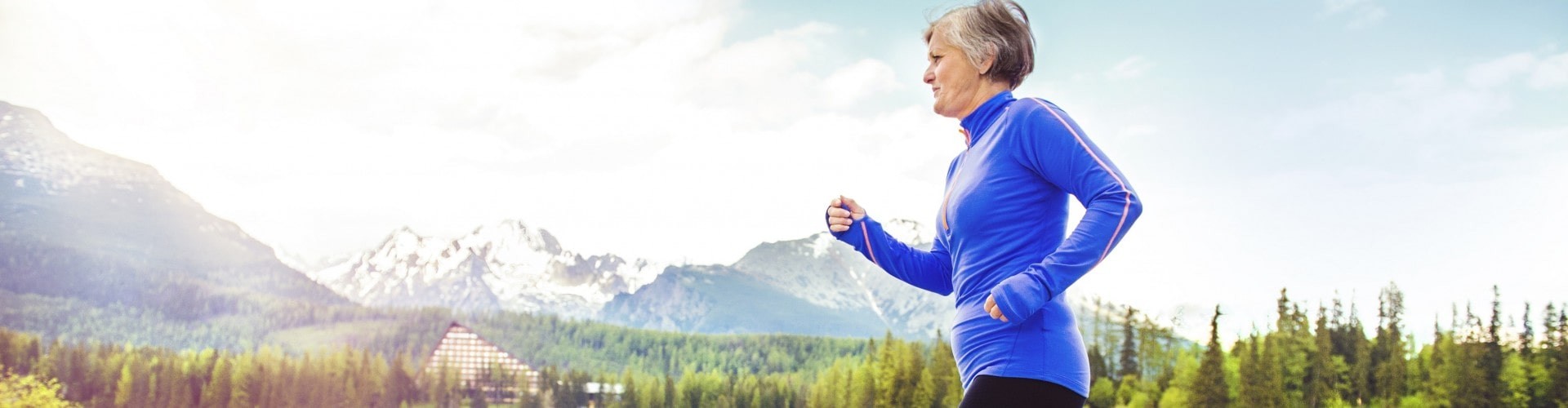 senior woman jogging in the beautiful outdoors